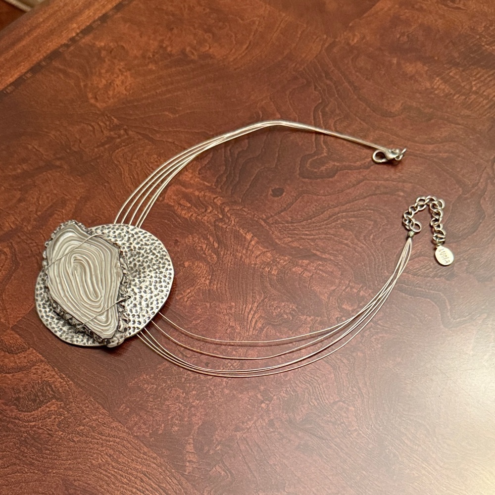 Elegant Silver Necklace with Textured Pendant